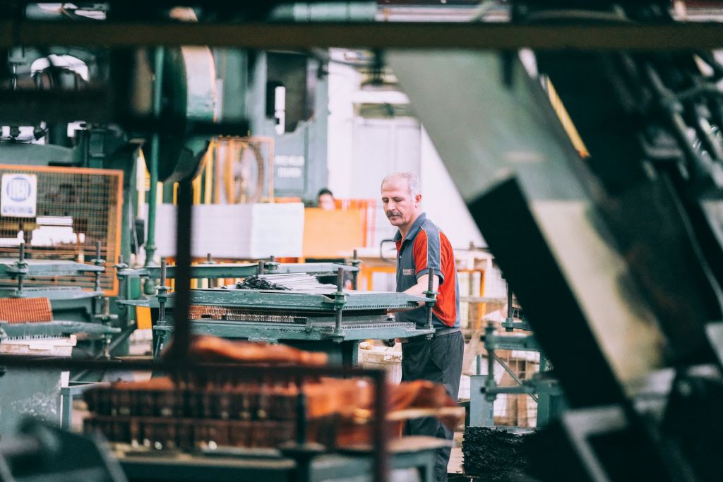 Worker operating machinery in a factory