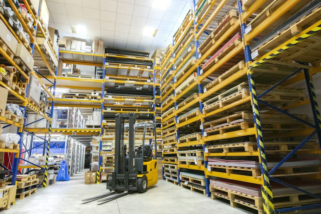 Warehouse with pallet racking and a forklift